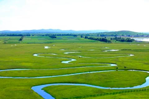 The river on the grassland Stock Photos