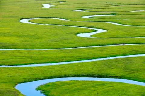 The river on the grassland Stock Photos