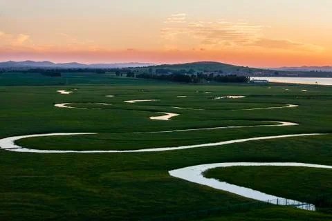 The river on the grassland Stock Photos