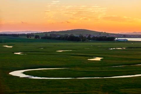 The river on the grassland Stock Photos