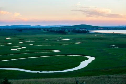The river on the grassland Stock Photos