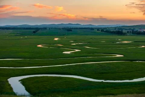 The river on the grassland Stock Photos