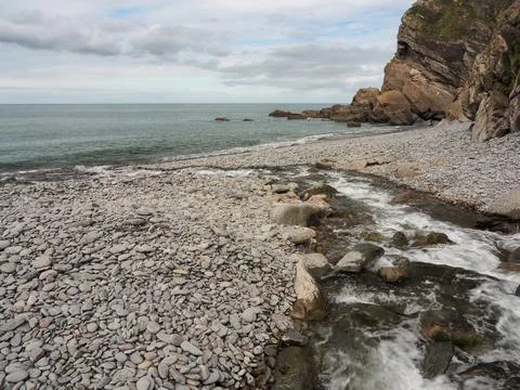 River Heddon flowing into the sea at Heddons Mouth, Exmoor, Devon Stock Photos
