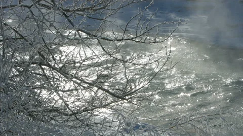 The river hovers in sunlight in winter Stock Footage 85715496