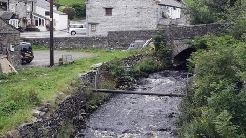 River Hull Pot Beck flows through Horton-in-Ribblesdale, North Yorkshire. Video stock 117544427