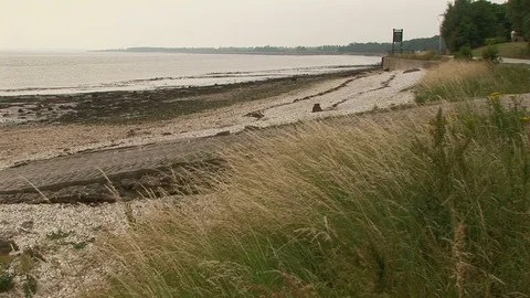 River Humber with a passing train the far background in Hull, UK Stock Footage 105267242