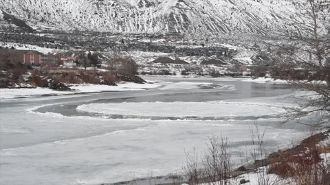 River ice disc, a very rare river effect, forms at the junction of two currents Stock Footage 150969320