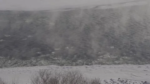 River ice floating by in frigid temperatures Stock Footage 310532491