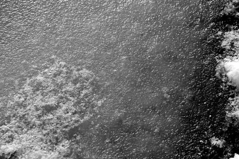 River ice texture background close up. Black and white Stock Photos