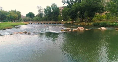 River landscape with bridge in the distance Stock Footage 124384240