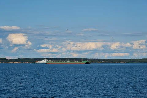 River landscape with a floating barge Stock Photos