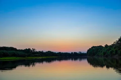 River landscape with Rio Negro at sunset Fazenda Barranco Alto Pantanal Mato Stock Photos