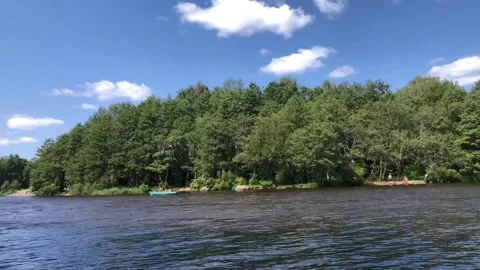River landscape with a rowboat, time lapse Stock Footage 317647045