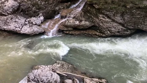 River landscape with a strong stream and a waterfall Видео 308093937