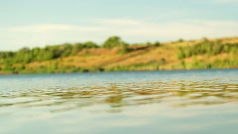 River landscape in summer, light waves on the water and beautiful reflections Stock Footage 280594200