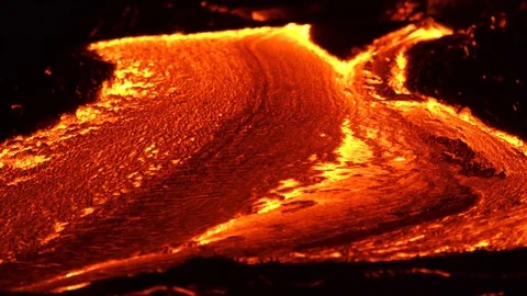 River of lava 1 Night Glowing Hot flow from Kilauea Active Volcano Puu Oo Vent Stock Footage