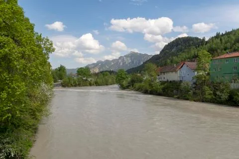 The river Lech in Germay in spring time with part of the City Fussen and moun Stock Photos