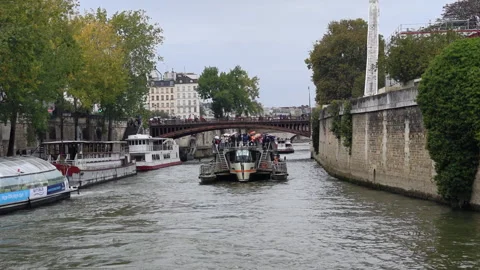 River-level view of the Seine in Paris, tourboats on river Stock Footage 328161260