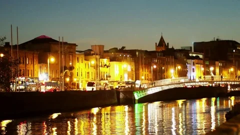 River Liffey and the famous Hapenny Bridge, night view cityscape, Dublin Ireland Stock Footage 73501112