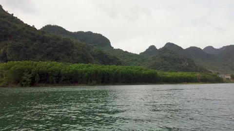 River with limestone mountains in Phong Nha Vietnam landscape Stock Footage 335280265