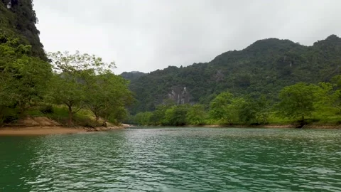 River with limestone mountains in Phong Nha Vietnam landscape Stock Footage 335280305