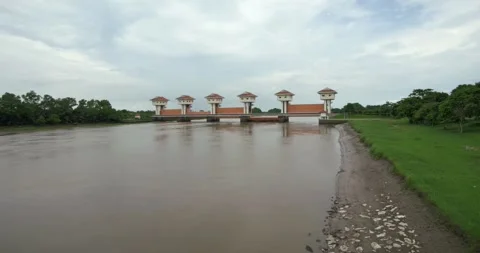 River management action at flood control gates rural area landscape calm waters Stock Footage 312880589