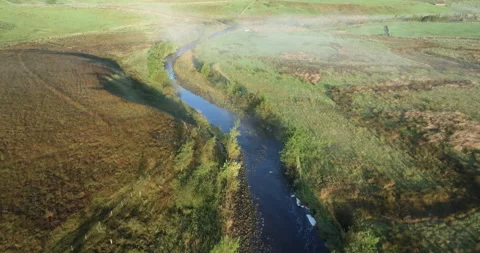 River in a misty valley Stock Footage 285357889