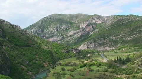 River Moraca Canyon from the train to Belgrade - pan Stock Footage 33354640