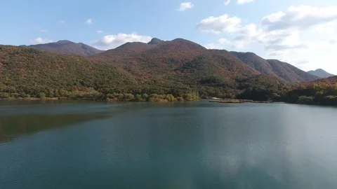 River with mountain, blue sky, drone shot 動画素材 303031551