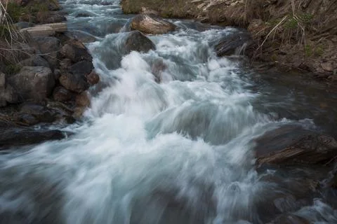 River from mountain with blurred water surface Stock Photos