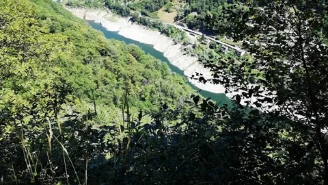 River, Mountain, Flowing river in the middle of a green mountain valley. Video stock 138530632