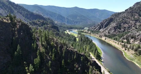 A River in a Mountain Valley Drone Aerial View Paradise Montana USA Video stock 335706324