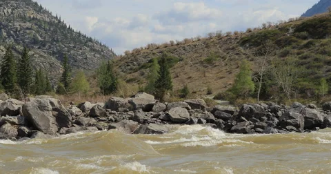 River in mountain valley at the foot  mountains. Landscape. Stock Footage 62921463