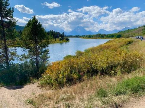 River with Mountains in Background Stock Photos