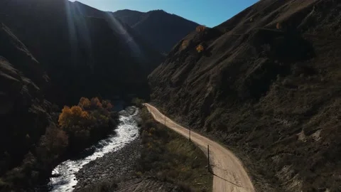 River in the mountains next to the road Stock Footage 171297256