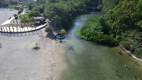 River mouth with abandoned structures and a boat, aerial view Stock Footage 278368854