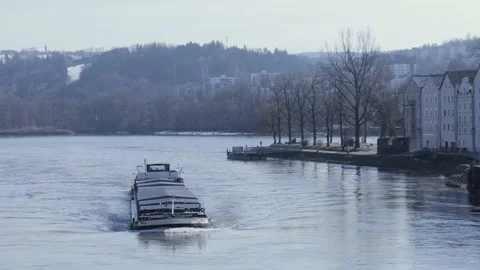 River navigation in Passau. Danube. Cargo ship sailing on the river Stock Footage 106817559