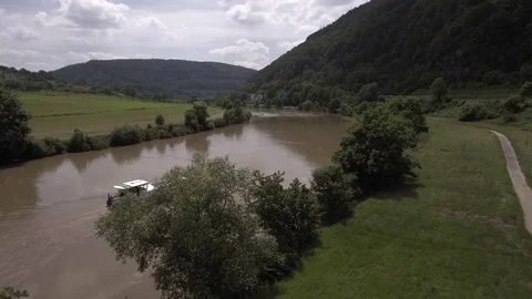River NECKAR, A small boat sails on the river NECKAR, Germany Видео 73583497