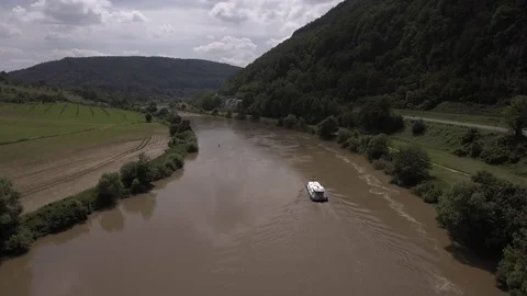 River NECKAR, A small boat sails on the river NECKAR, Germany Stock Footage 73583544