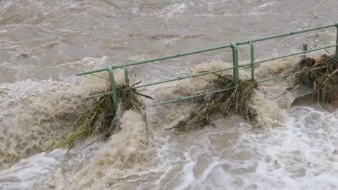 River overflows in floods, pedestrian stiles flooded with water. Stock Footage 284736138