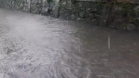 The river overflows with heavy rains and floods in the afternoon (5) Stock Footage 218200129