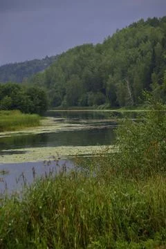 River oxbow during summer bad weather - a rainy cyclone hit the vastness of t Stock Photos