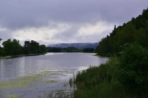 River oxbow during summer bad weather - a rainy cyclone hit the vastness of t Stock Photos