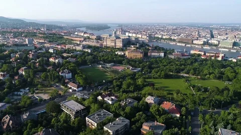 River passing through cityscape on a sunny day Stock Footage 83695662