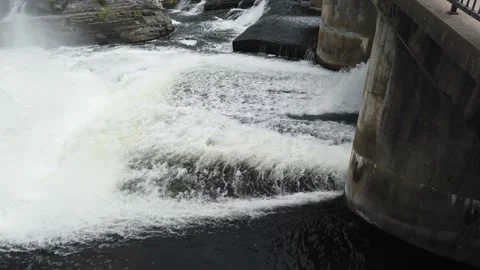 A river passing through a dam Stock Footage 138650521
