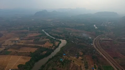 A river passing through farm lands Stock Footage 111618443