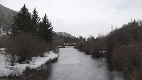 River passing through a forest during winter Stock Footage 84505517
