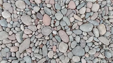 River pebbles with different textures close-up. Stone background Stock Photos