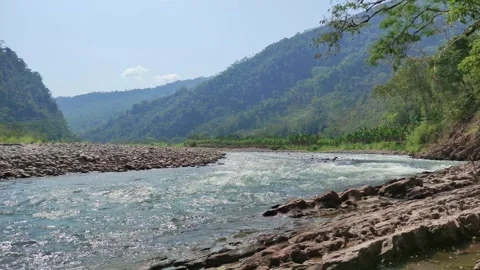 River in Peru with trees, shore and mountains. 動画素材 282218266