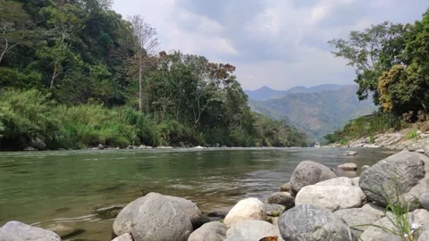 River in Peru with trees, shore and mountains. Видео 282558456